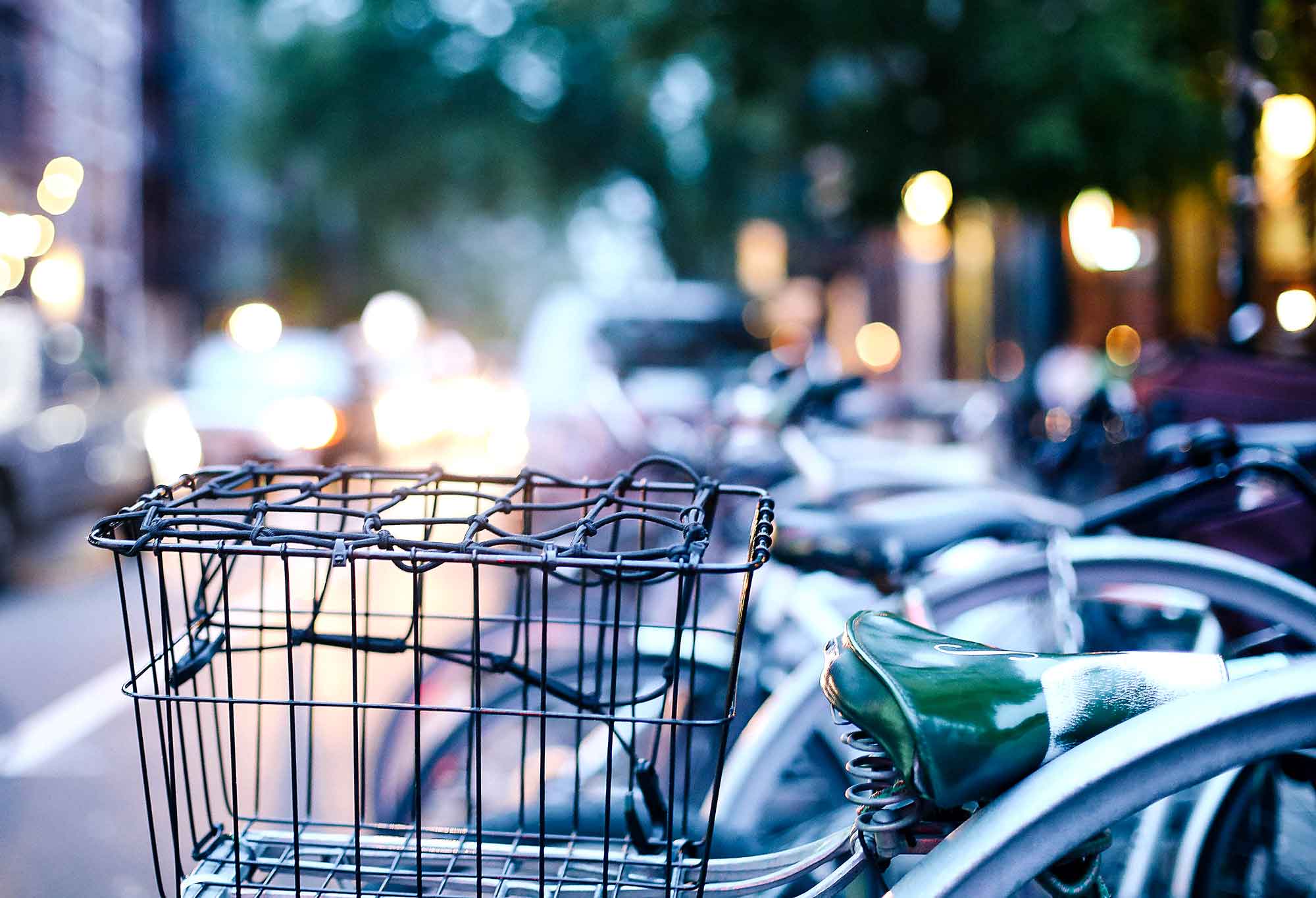 Many bikes locked up on urban street